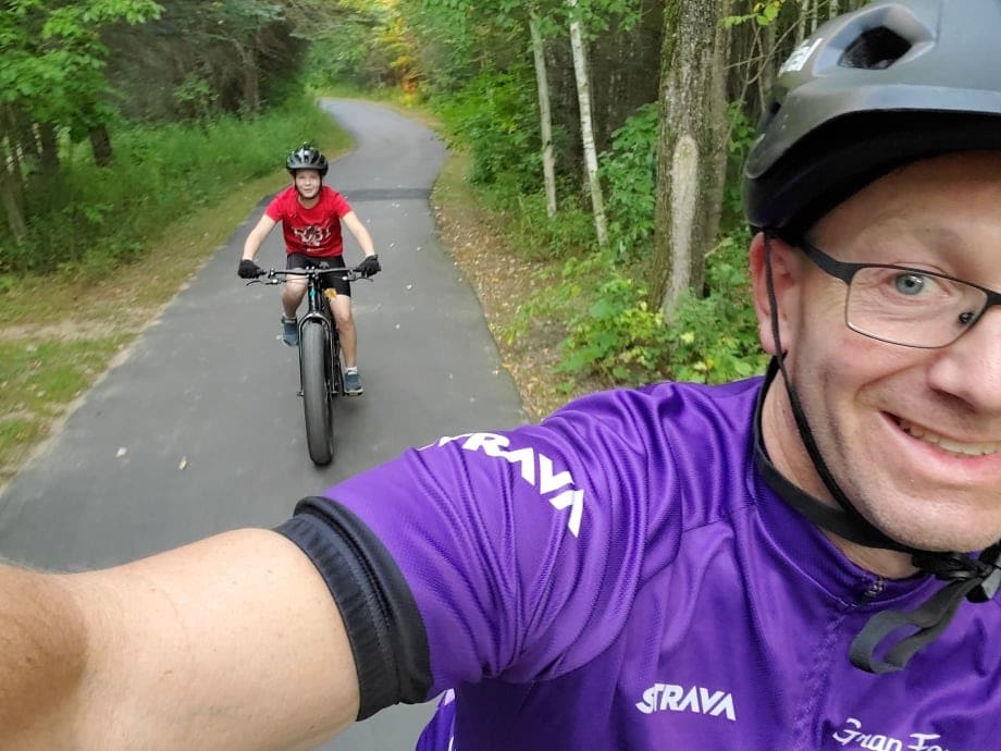 Carson Bretz riding bikes with his dad Jason