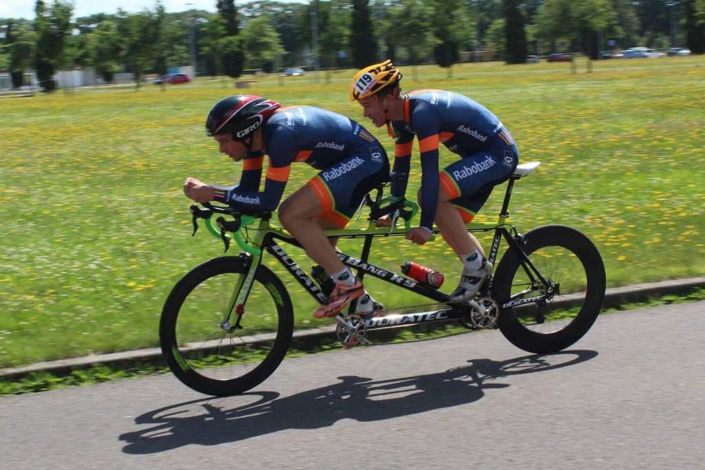 tom Gakes racing a tandem bicycle