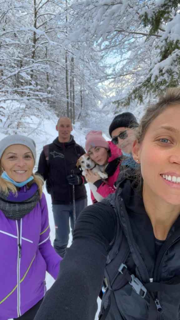 Chiara Doni and her family standing together in the snow