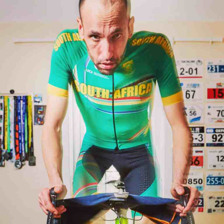 cyclist aaron borrill riding indoors out of the saddle