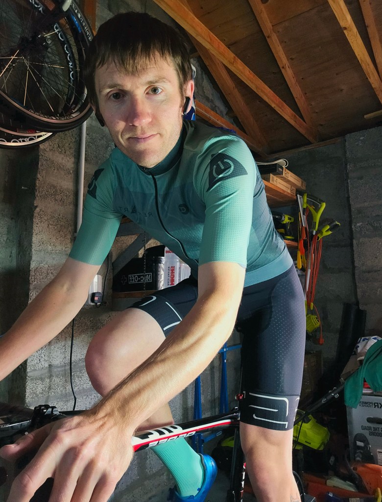 Elite cyclist Dean Cunningham riding bike indoors