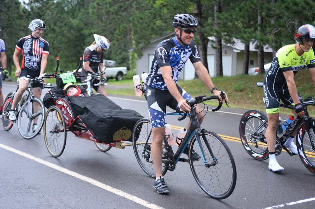 Jordan preparing to ride a triathlon with his son Jeffrey
