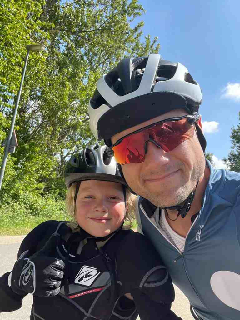 Father and son riding bikes outdoors