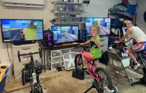 The Larson's cycling indoors as a family