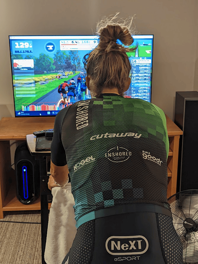 Challenges in the World of Cycling Esports racer riding indoors