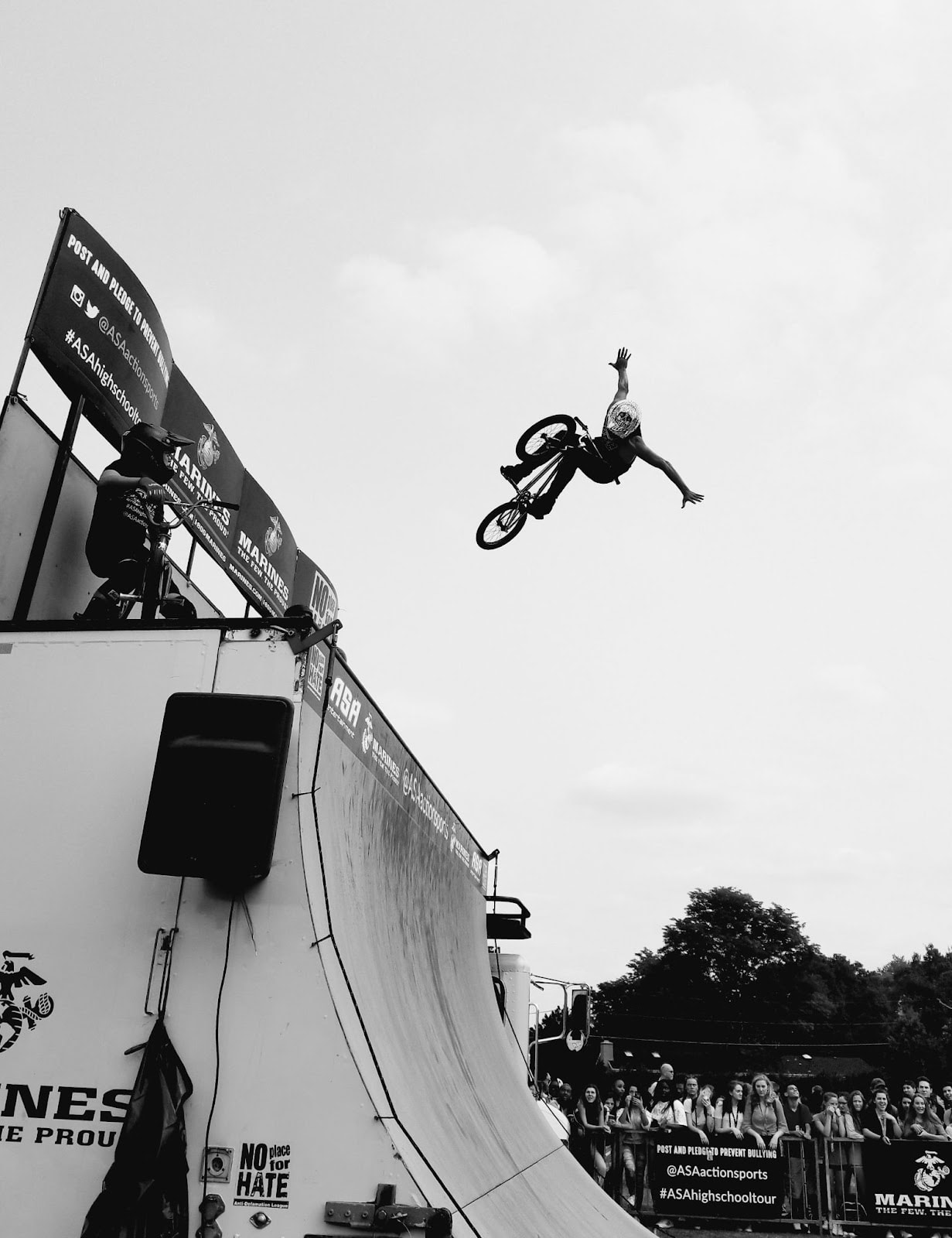 BMX freestyle rider flying out of halfpipe