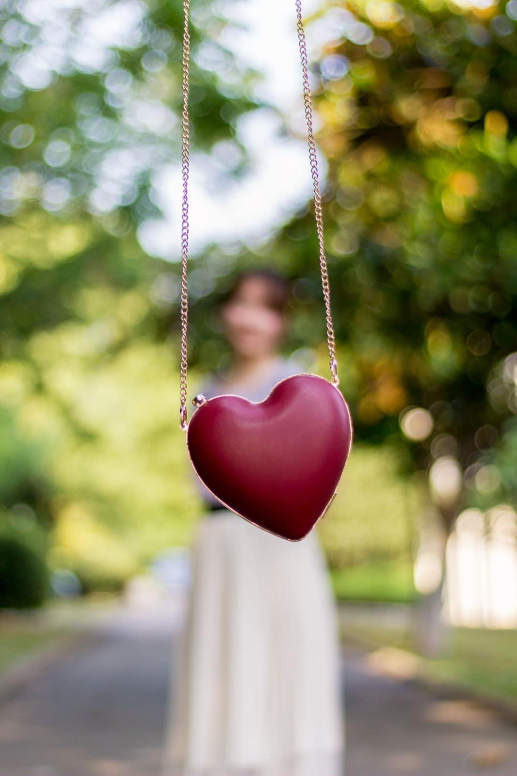 a heart pendant on a gold necklace chain